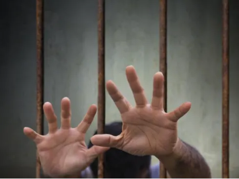 How should one choose for a prison to implement mobile phone signal shielding?